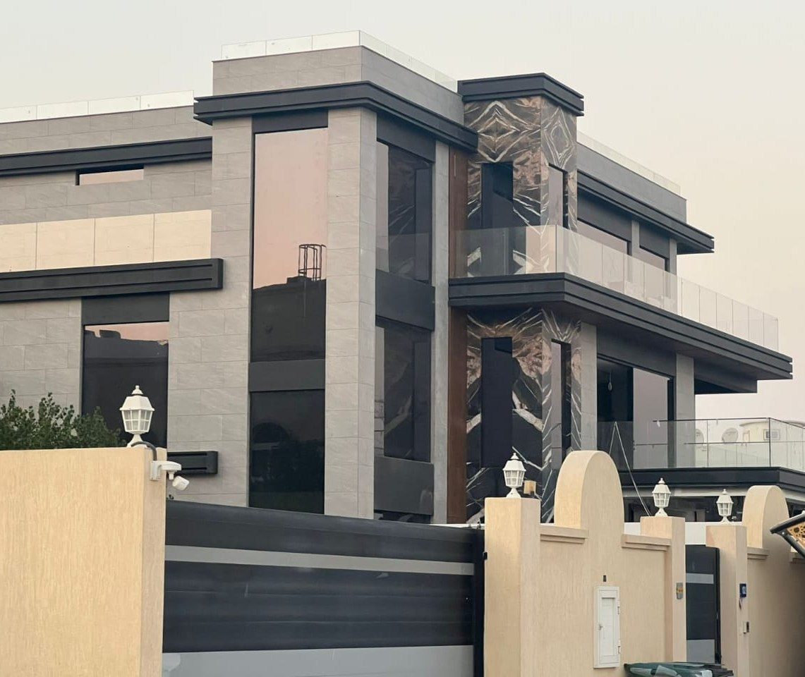 Large-format glass facade and balcony balustrade on a modern villa in Al Barsha Dubai