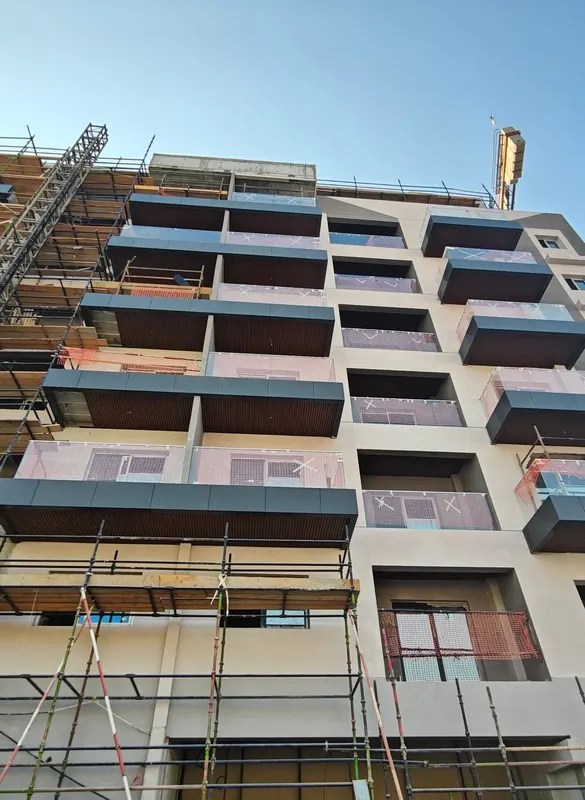 Repeated balcony glazing on the facade of Moonsa Residencies G+7 residential building, Dubai